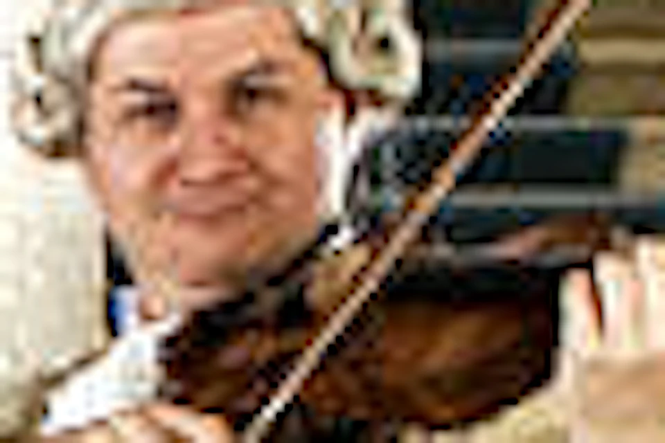 A group of musicians in ornate historical costumes play string instruments in an elegant hall with blue curtains and arched columns.