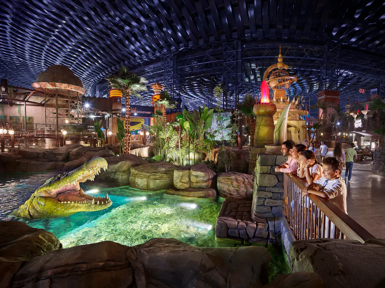 Families enjoying rides and attractions at IMG Worlds of Adventure indoor theme park in Dubai
