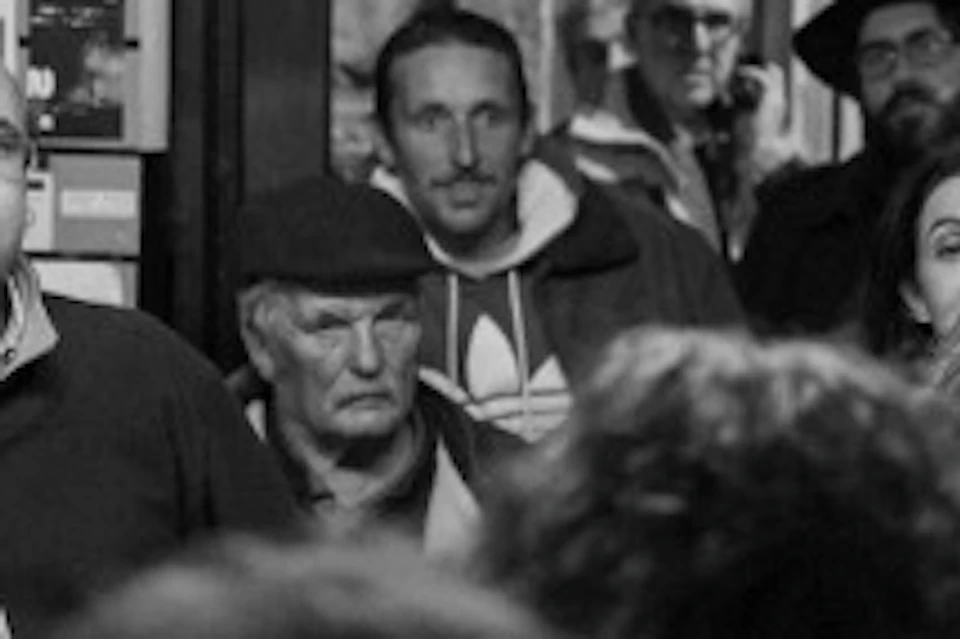 A local tavern in Mouraria, a group listening to the guide while they wait for the "Ginjinha".