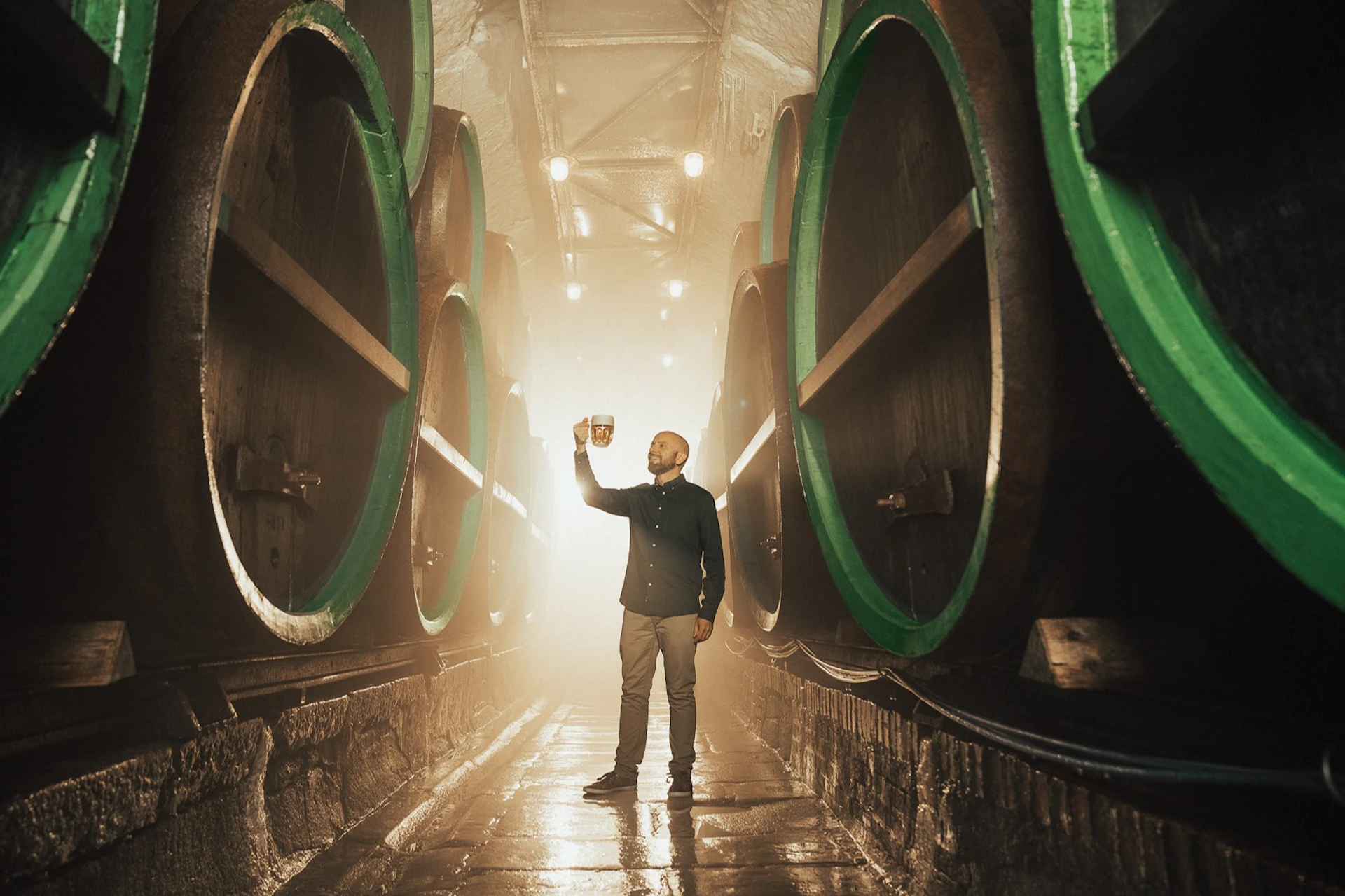 Tasting unfiltered Pilsner Urquell beer in historical cellars