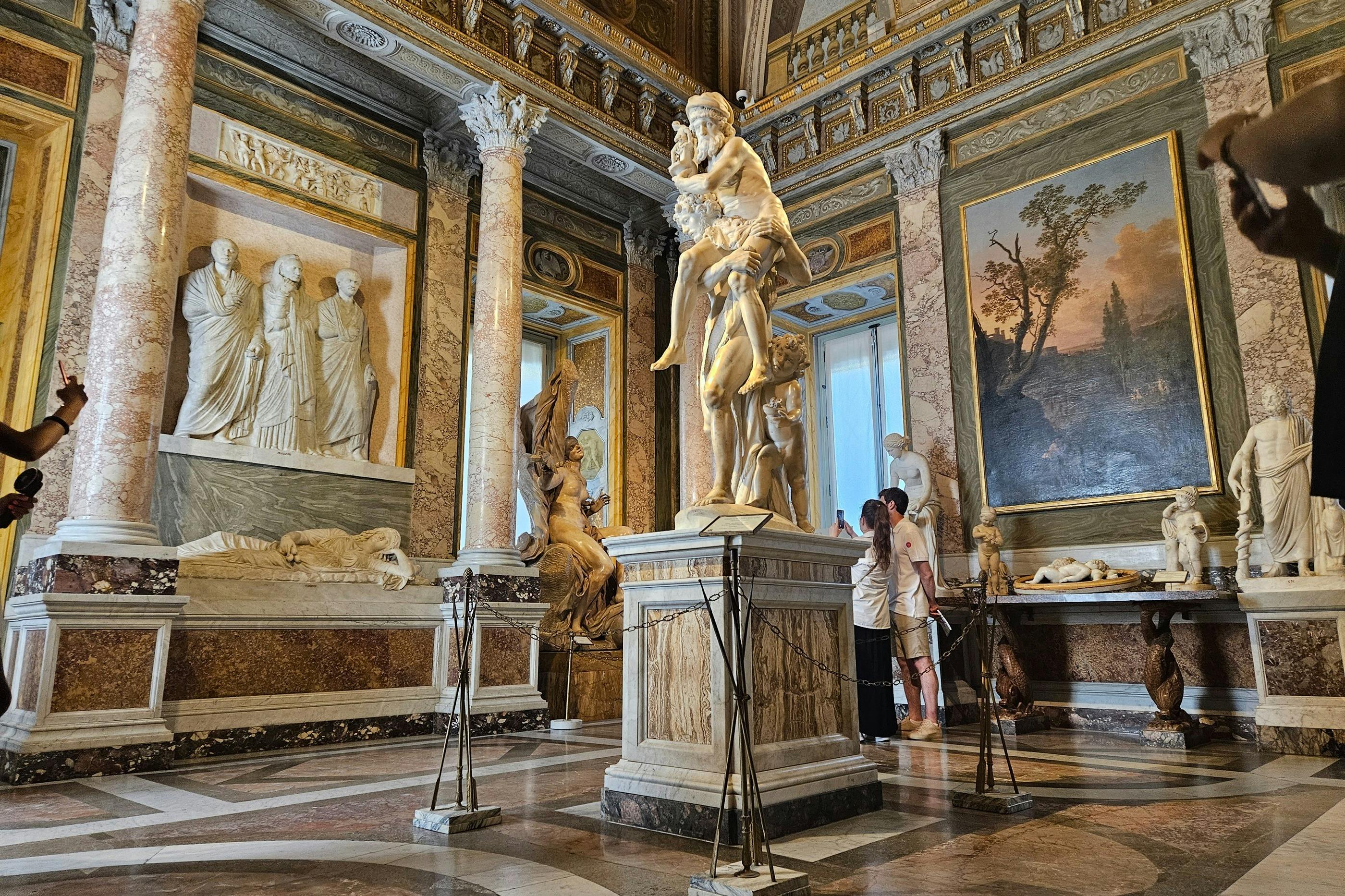 Pause before the sculpture of Aeneas, Anchises, and Ascanius, another one of Bernini's masterpieces inside the gallery.