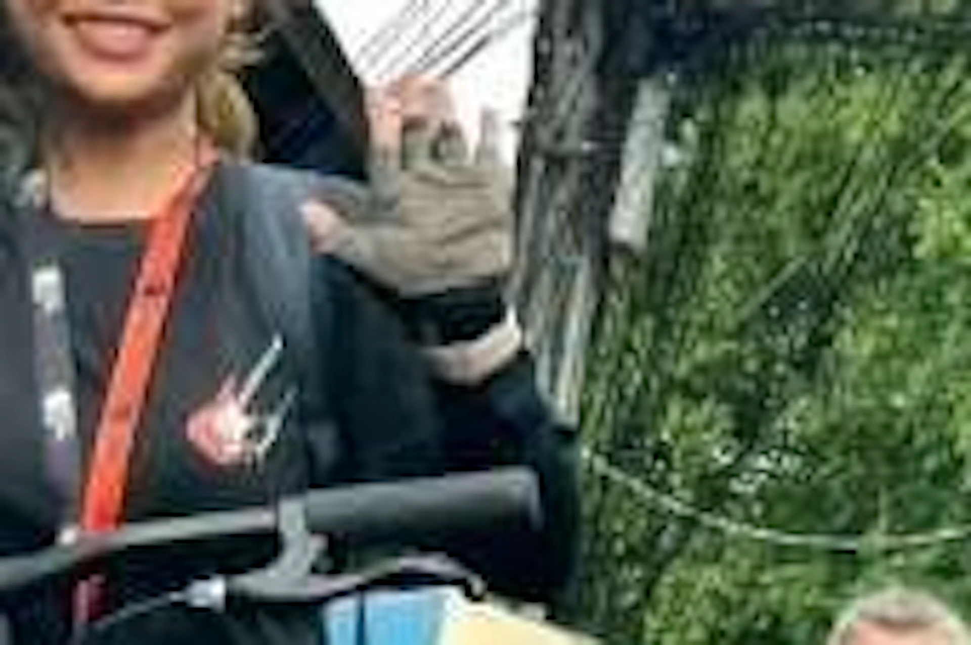 Tour guests cycling through Bangkok’s local backstreets with a smiling guide