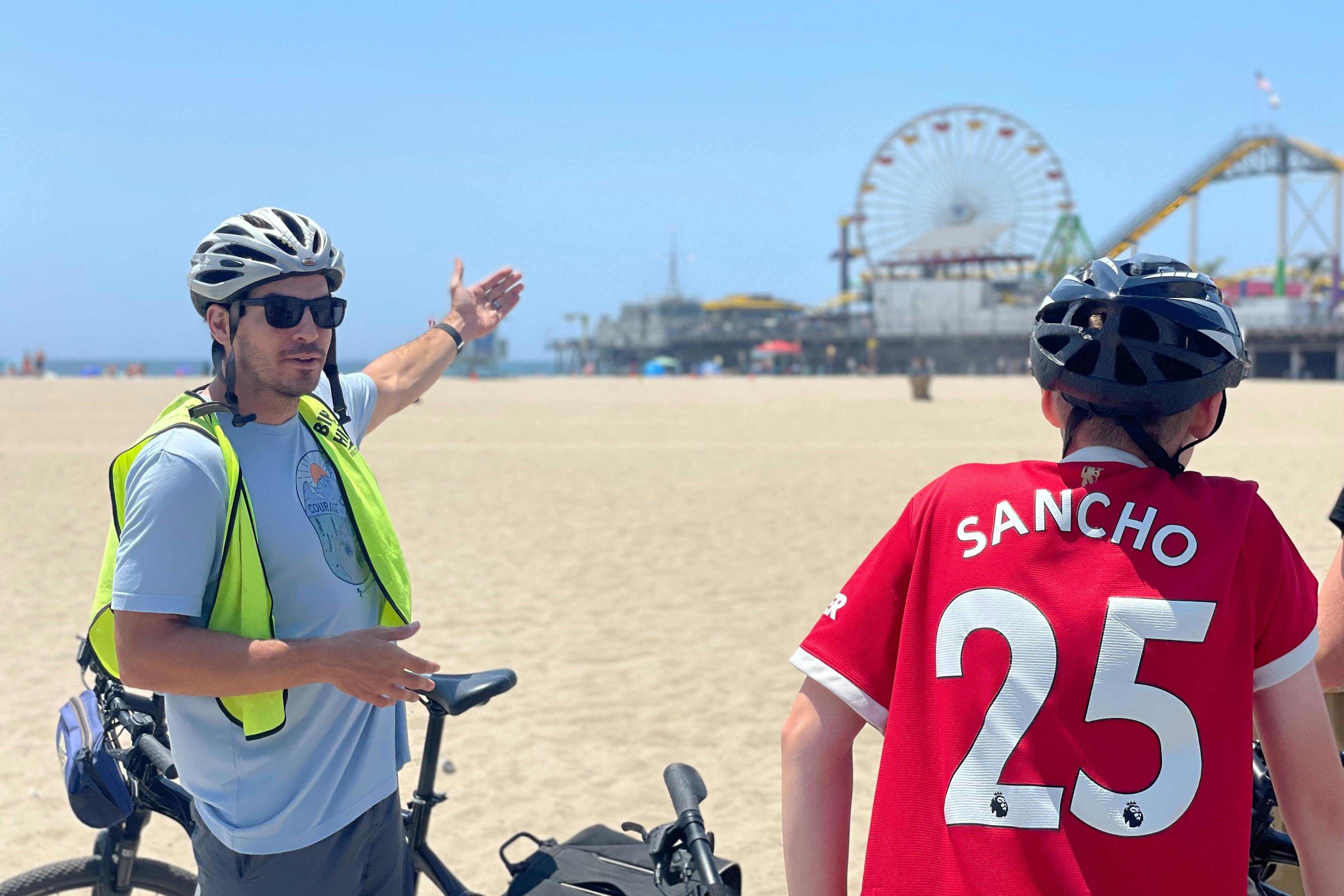 In front of the Santa Monica pier on this guided tour