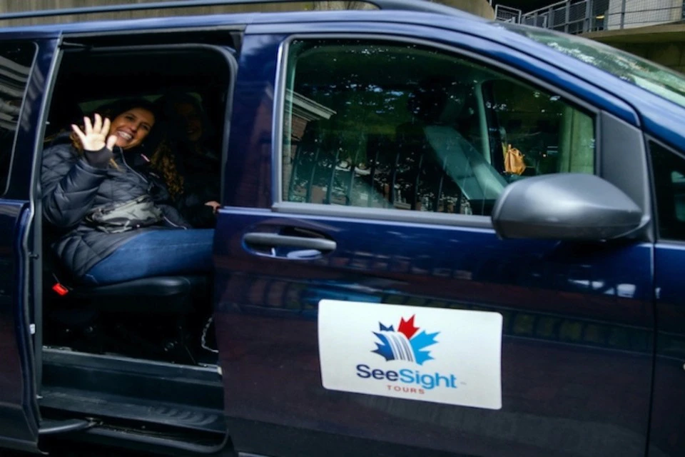 A guest in a See Sight Tours van.