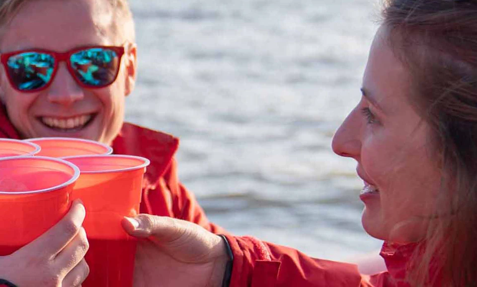 Enjoy a complimentary drink on board a Thames Rockets speedboat at sunset