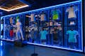 Exhibition area with the T-shirts and shoes of some of the Grand Slams won by Rafa Nadal.