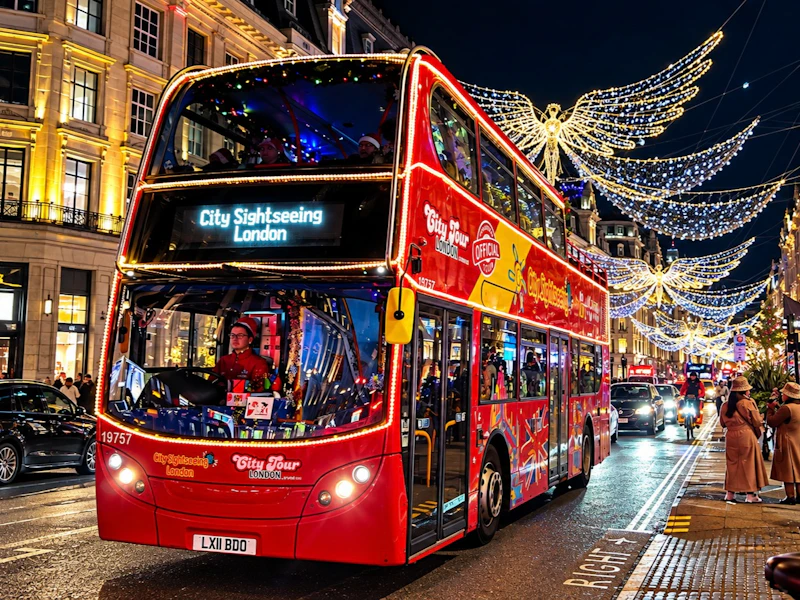 London: Christmas Lights Bus Tour with Audio Guide + One-Way Uber Boat