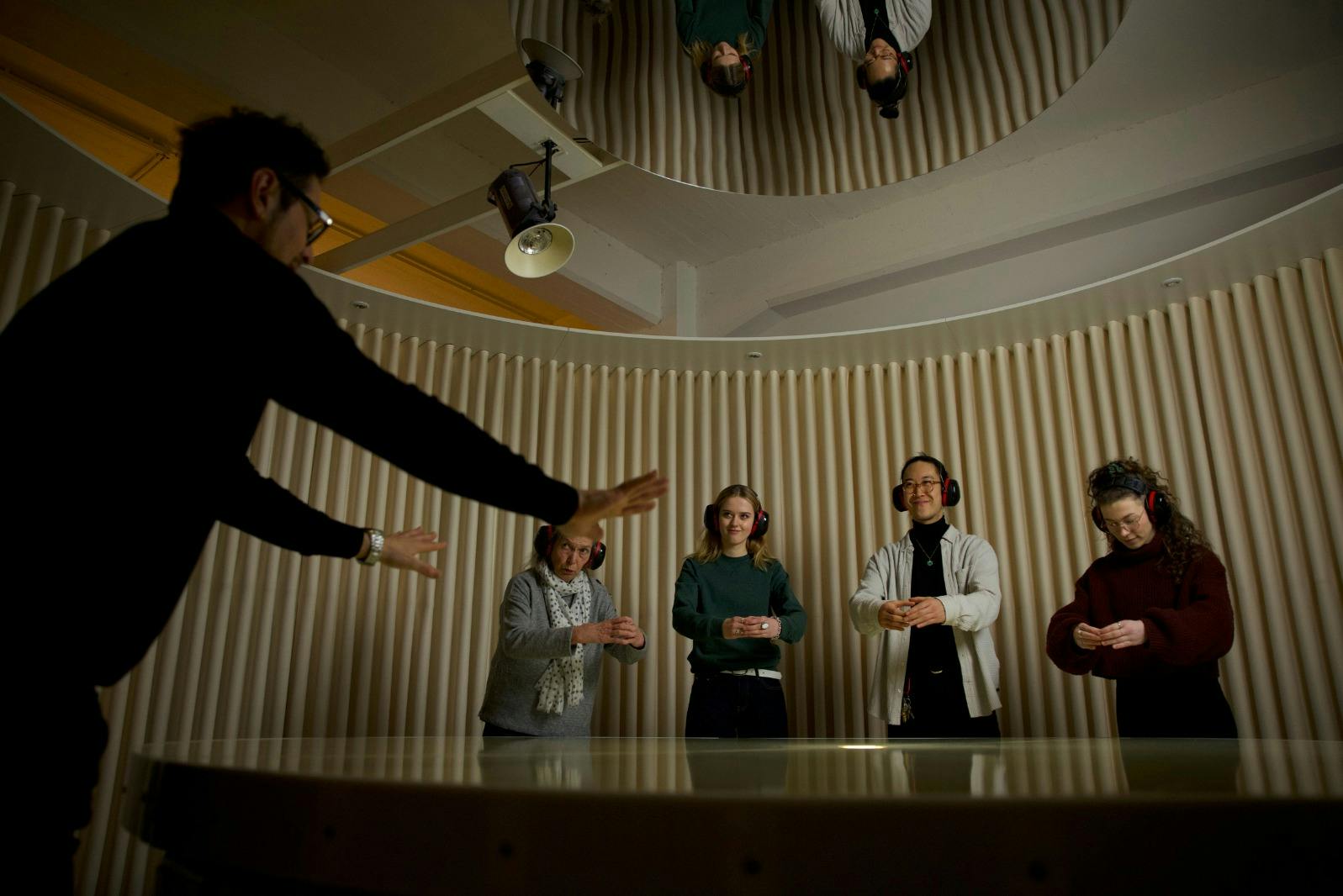 Guests have their task explained to them by a deaf guide.