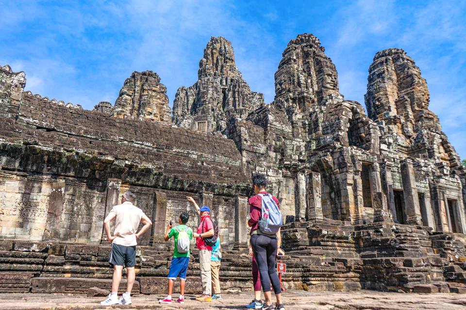 Explore the fascinating beauty of Bayon Temple, Terrace of Elephants, and Baphoun Temple at the Angkor Thom complex.
