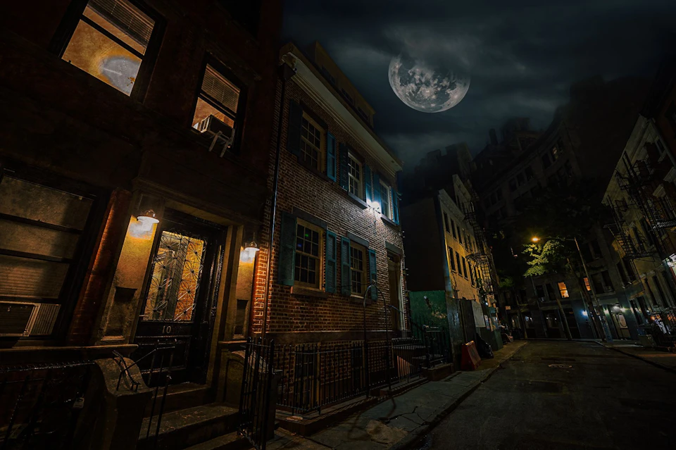 Spooky nighttime photo of the 12 Gay Street in New York with a spooky skies overhead