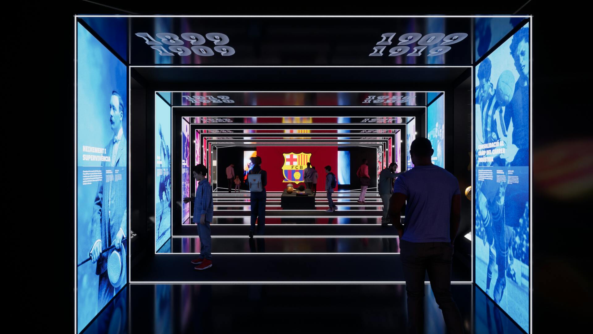 Des personnes traversent un tunnel illuminé dont les murs sont recouverts de miroirs et qui affiche en arrière-plan un grand emblème du FC Barcelone.