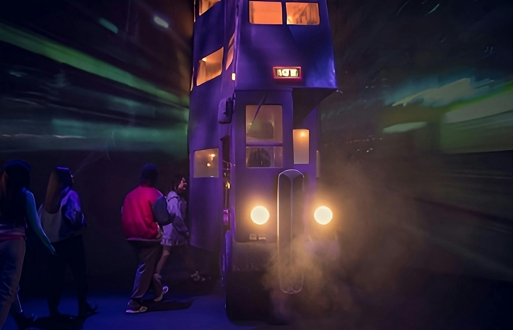 Two people near a purple, triple-decker bus with lit windows and headlights, surrounded by theatrical smoke and dim lighting.