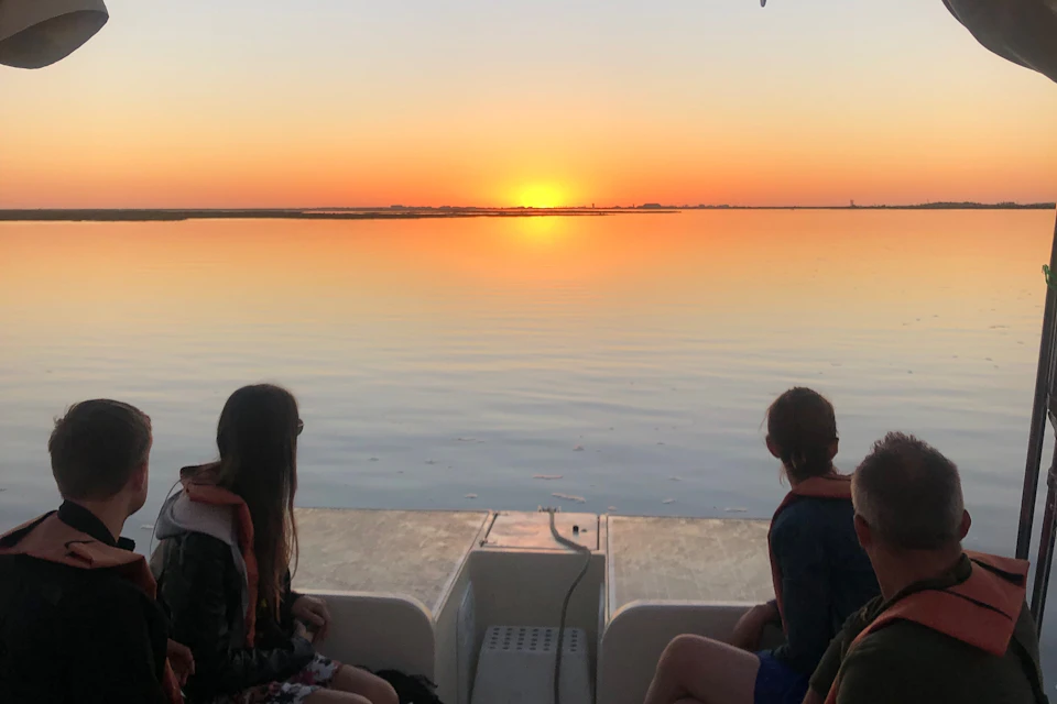 Guests enjoying the Ria Formosa at sunset on this Algarve Boat Tour