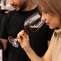 A woman and a man are participating in a wine tasting in Barcelona.