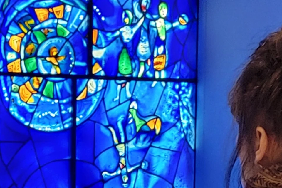 Guide showing Chagall's America Windows
