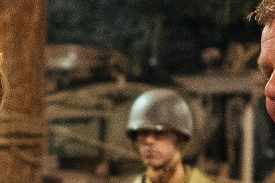 Museum visitors with guide in exhibition with W.W.II Military vehicles in War Museum Medemblik in the Netherlands