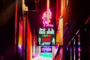 Some of the neon signs found within the Red Light District