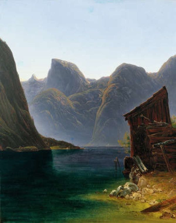 A serene lake surrounded by towering mountains with a weathered wooden cabin on the shore under a clear sky.