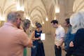 .Guide and group inside the main hall of the Conciergerie