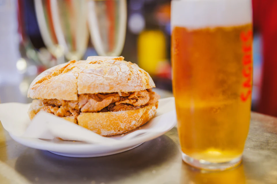 Pork chop sandwich and beer