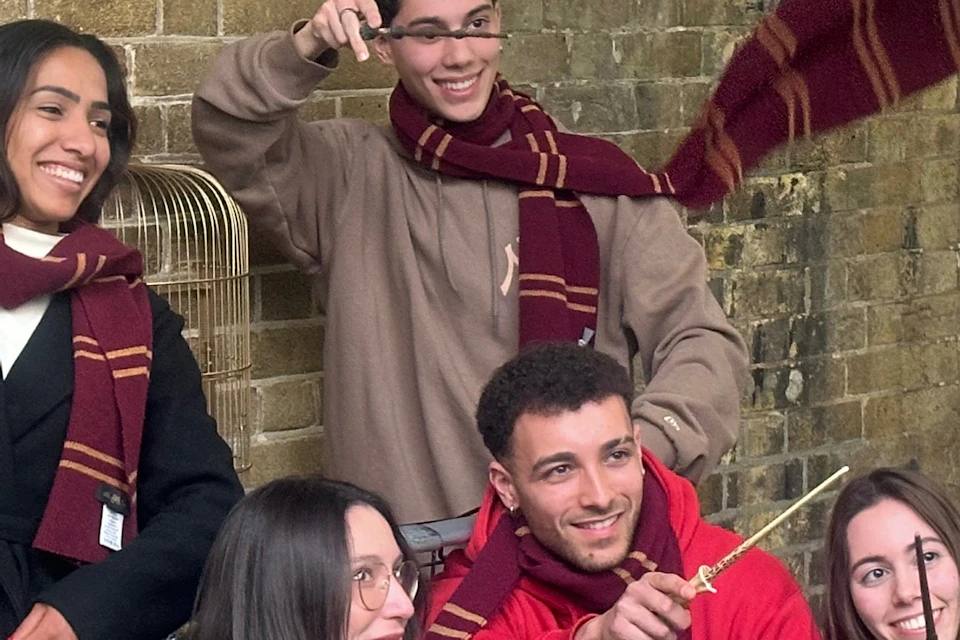 Family holding wands