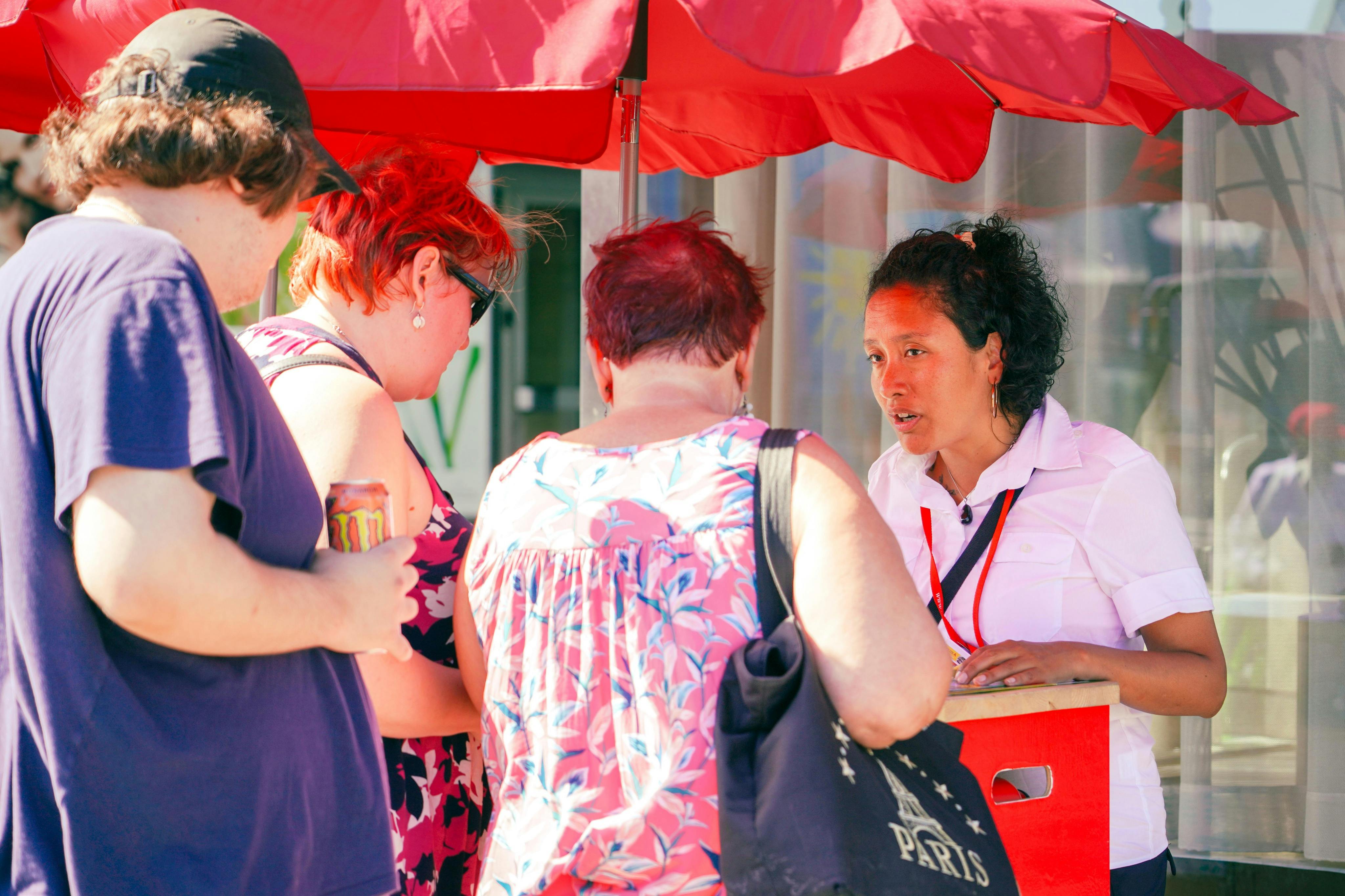 Guests buying tickets for the Hop On-Hop Off bus tour.