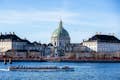 Covered canal boat with a view of Amalienborg Palace and the Marble Church