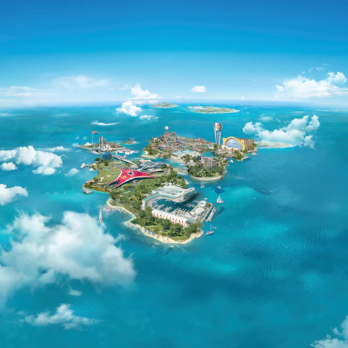 Luftaufnahme einer Insel mit modernen Gebäuden, einer roten sternförmigen Struktur, Booten auf türkisfarbenem Wasser und verstreuten Wolken.