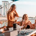 group of girls enjoying drinks on morning cruise
