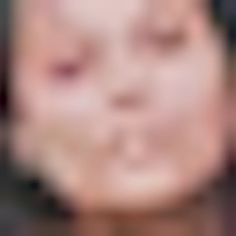 An art gallery with portraits on distressed walls, a sculpture on a pedestal, and a mannequin torso on a table.