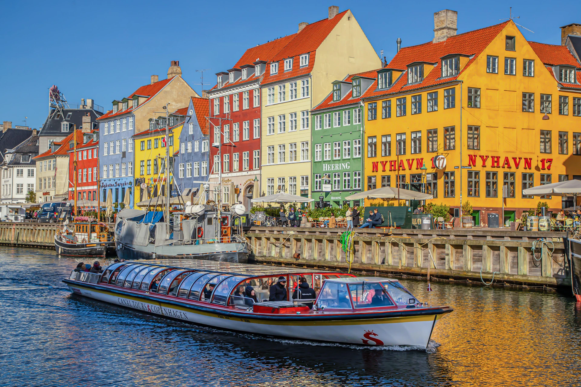 Guests aboard a covered and heated Classic Canal Tour during winter.