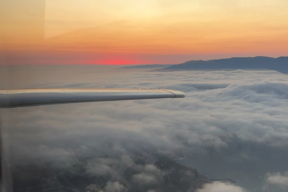 Sunset over the clouds