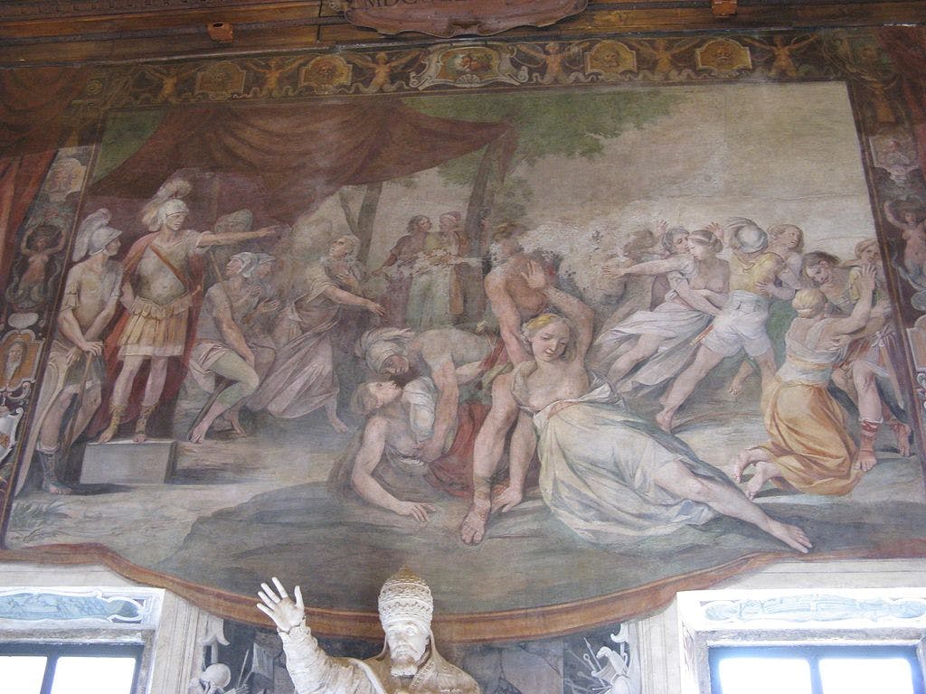 A detailed fresco depicting multiple figures in dynamic poses, some appearing in distress or conflict, with a statue in the foreground.