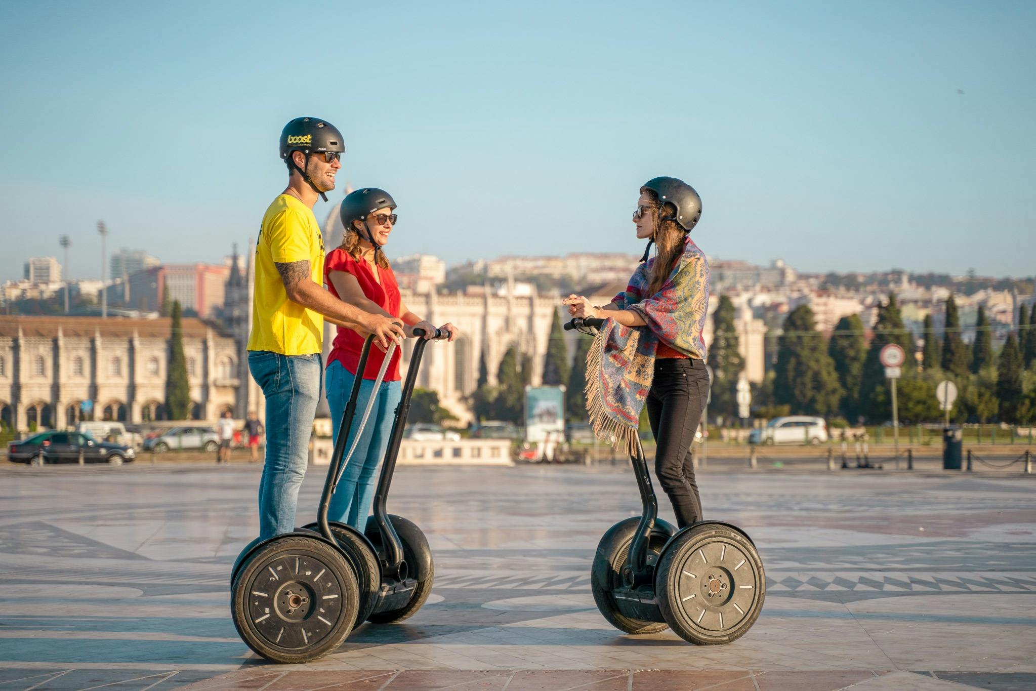 Tourists exploring Lisbon with a Segway guide tour. Enjoying some break time.