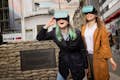 Two girlfriends with VR glasses at Checkpoint Charlie