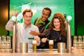 Tourists at the Heineken Experience pouring a beer