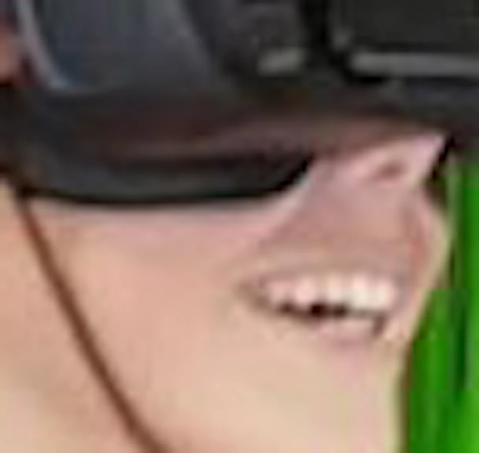 Person using VR headset in a simulator seat with red harness, logo "VR FUN Virtual Reality Park" at bottom left.