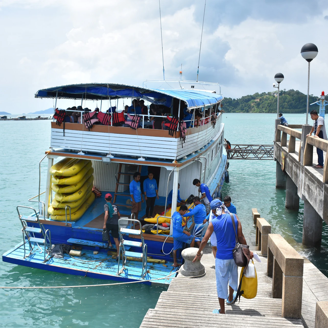 Board the escort boat at Ao Por Pier in Phuket