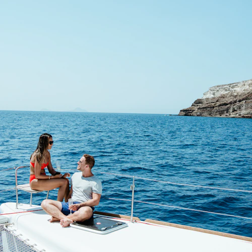 Relaxing on a catamaran yacht by Sirigos Sailing