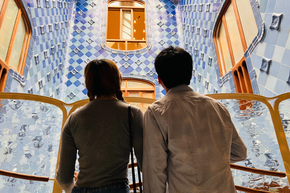Visitors admiring the tile work at Casa Batlló