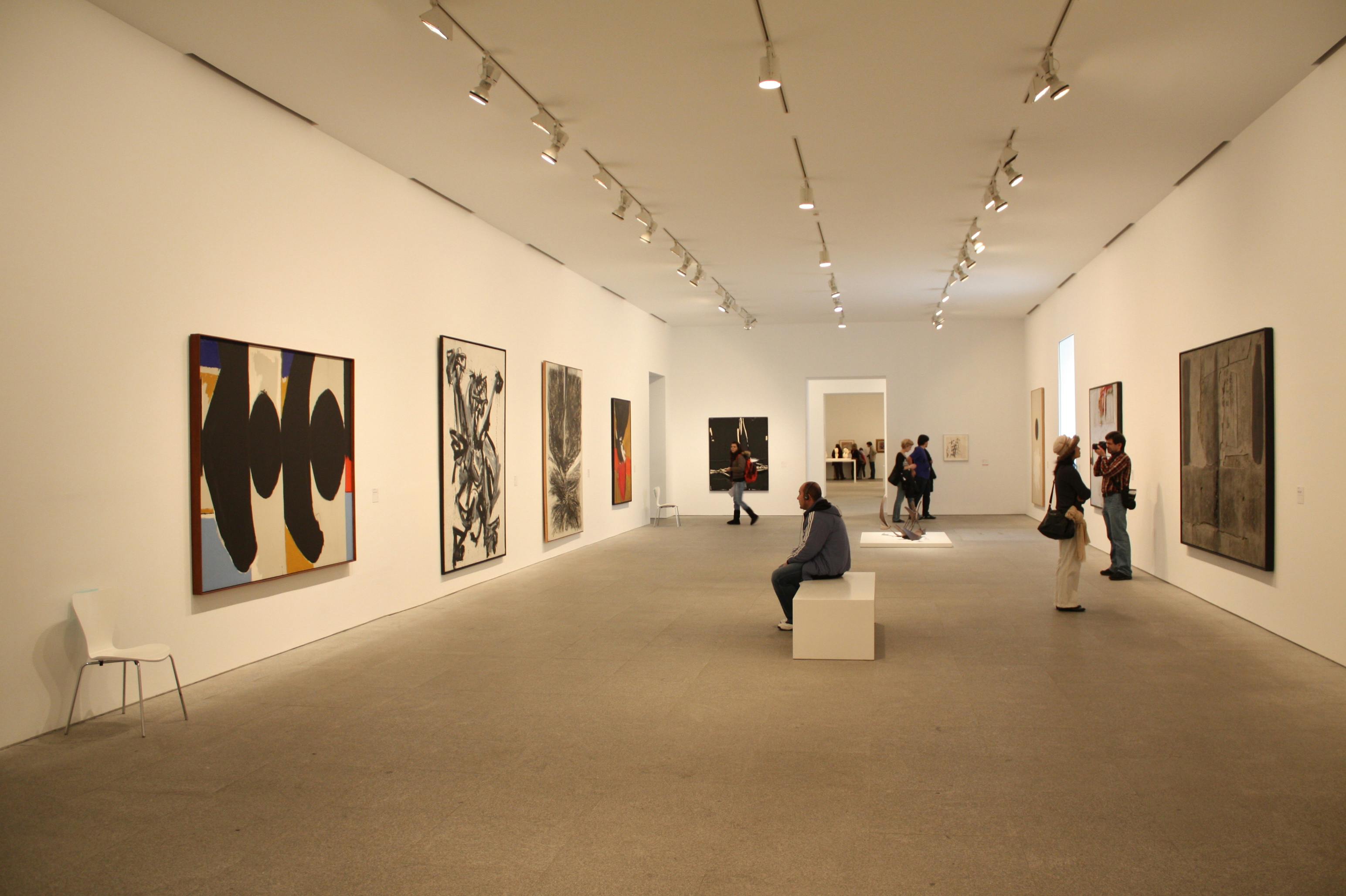 Image of room at Reina Sofia Museum with people looking at art