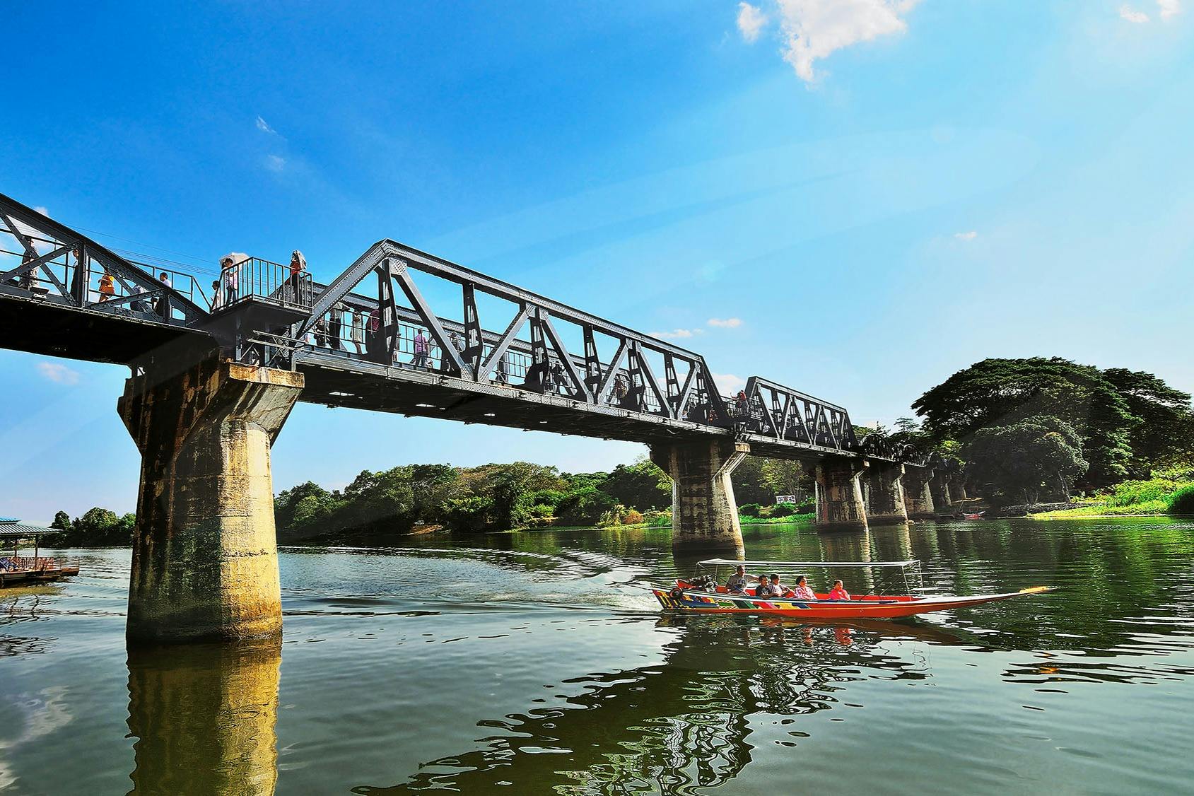Long Tail Boat under River Kwai Bridge