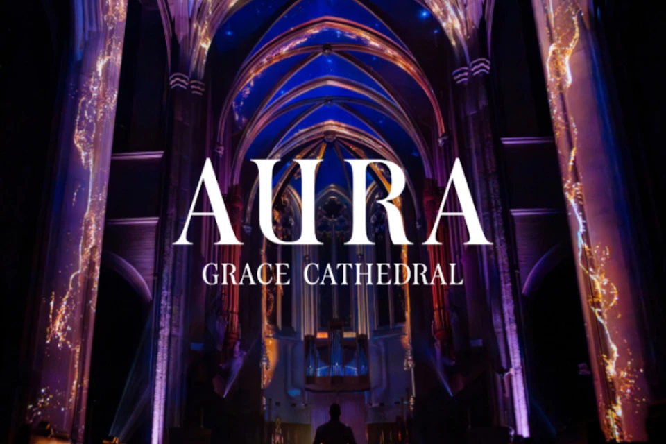 Interior of a cathedral with illuminated arches and text overlay reading 'Aura Grace Cathedral.'