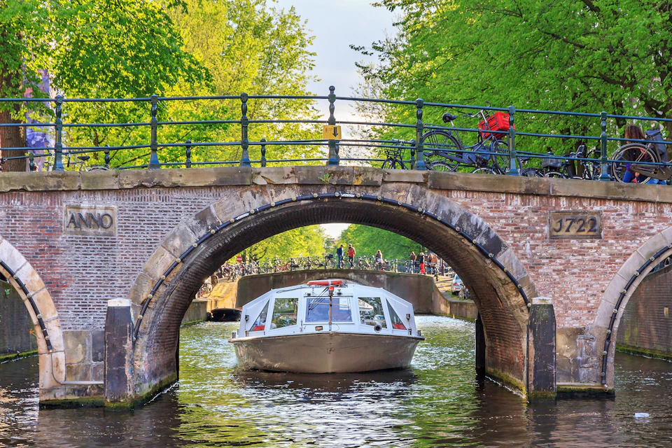 canal in amsterdam with boat