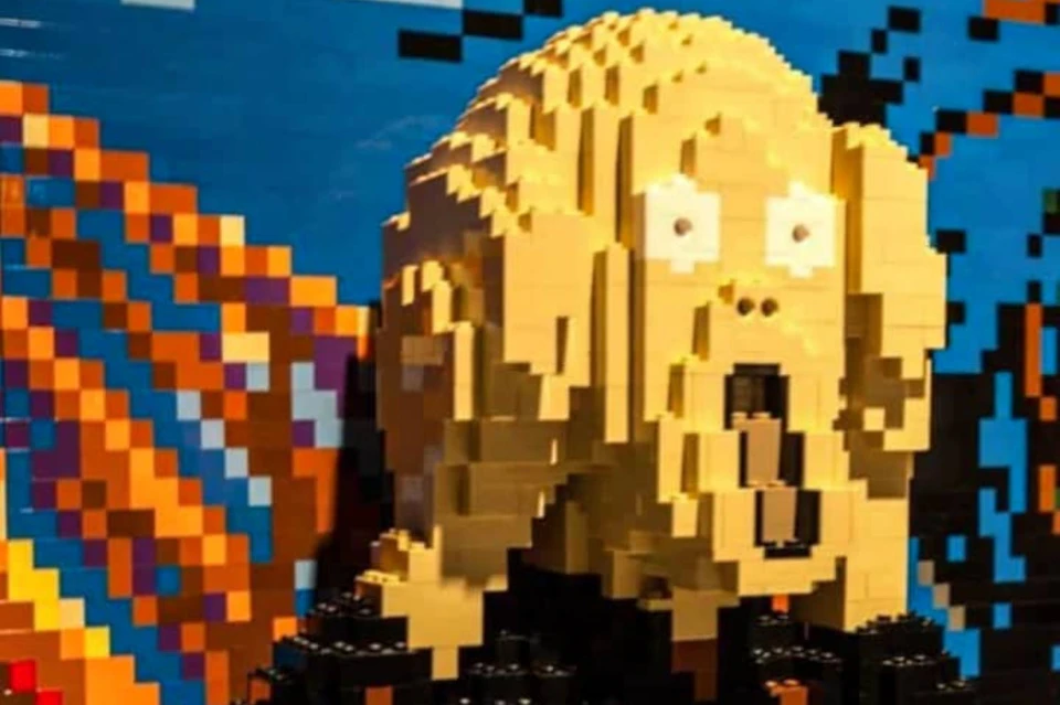A Lego sculpture depicting the face from Edvard Munch's 'The Scream,' set against a colorful background.