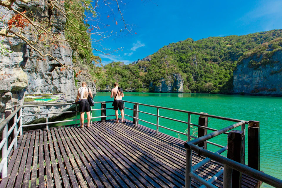 Discover the "Emerald Lake," a hidden gem surrounded by lush greenery.