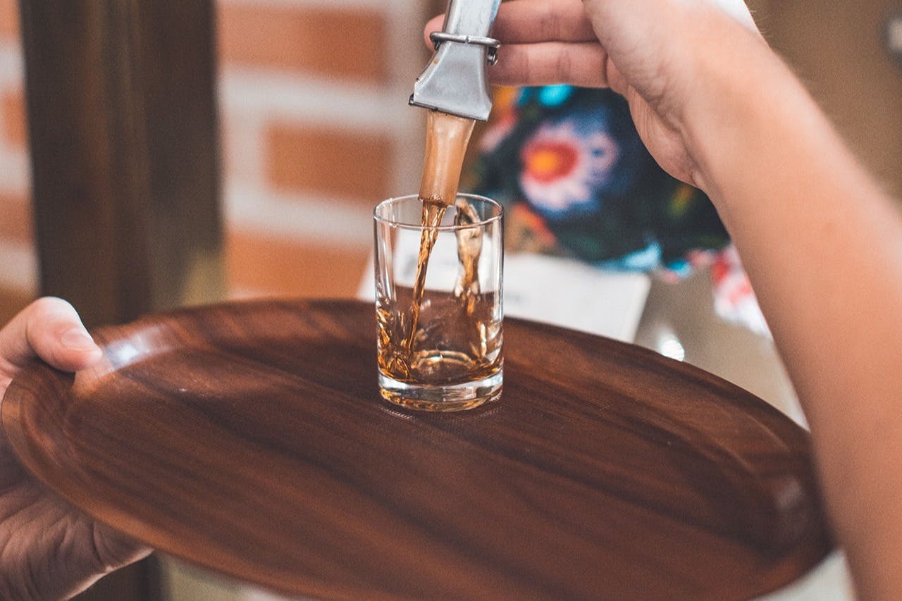 Flavored vodka being poured from the bottle