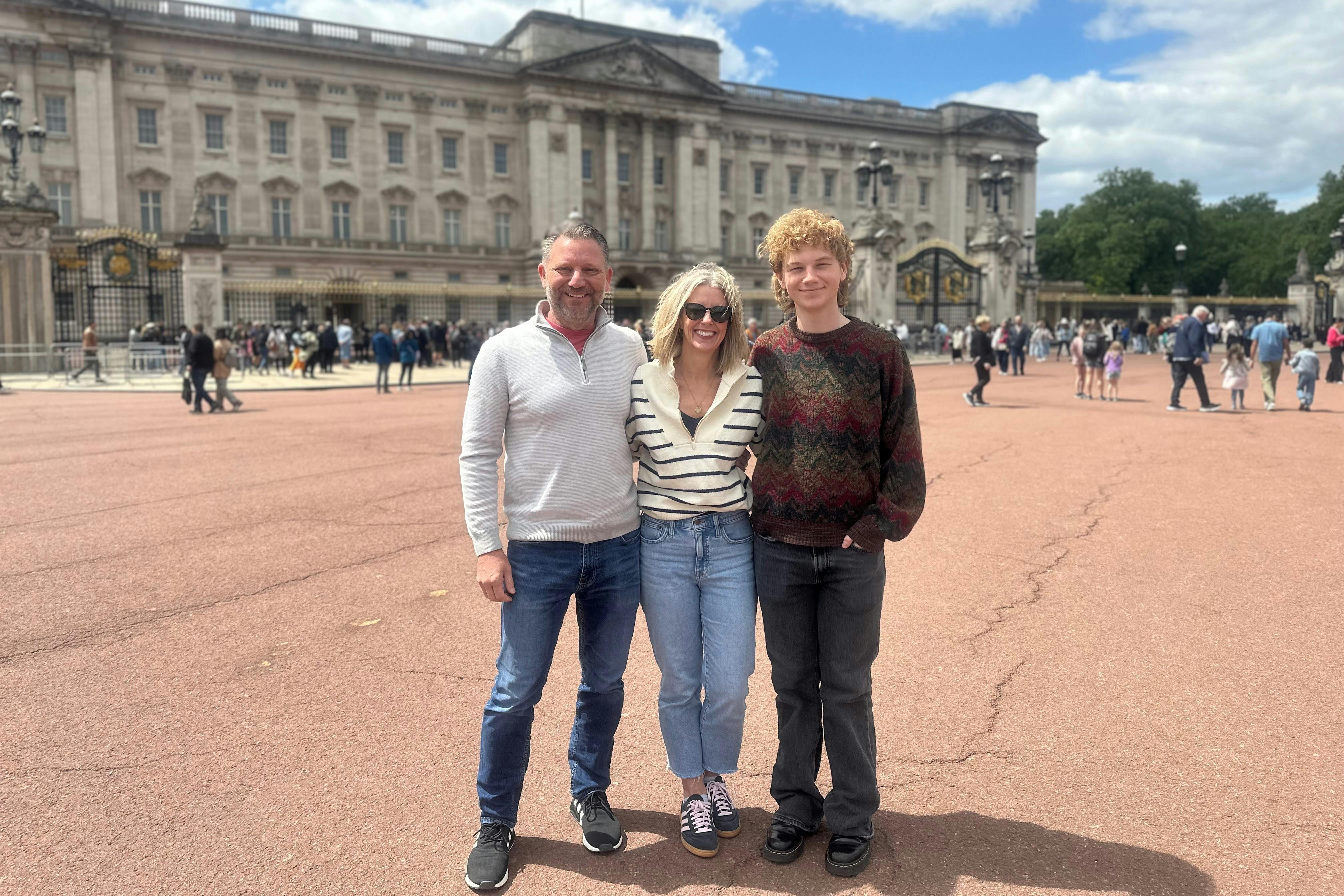 Family standing in front of Buckingham Palace