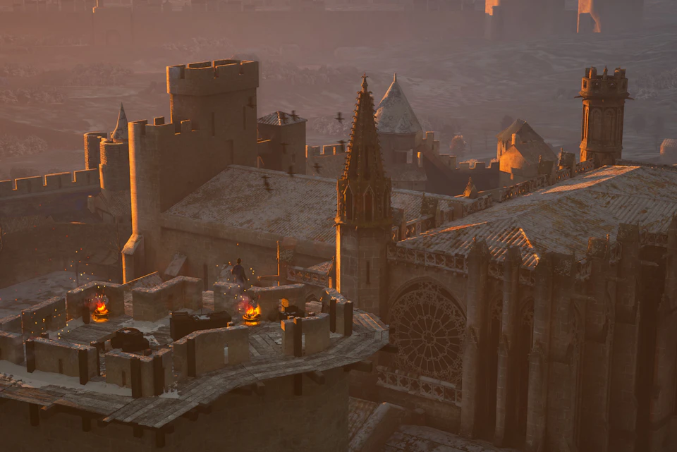 Medieval castle rooftops at sunset with a group of people around a small fire. Gothic architecture and spires are visible.