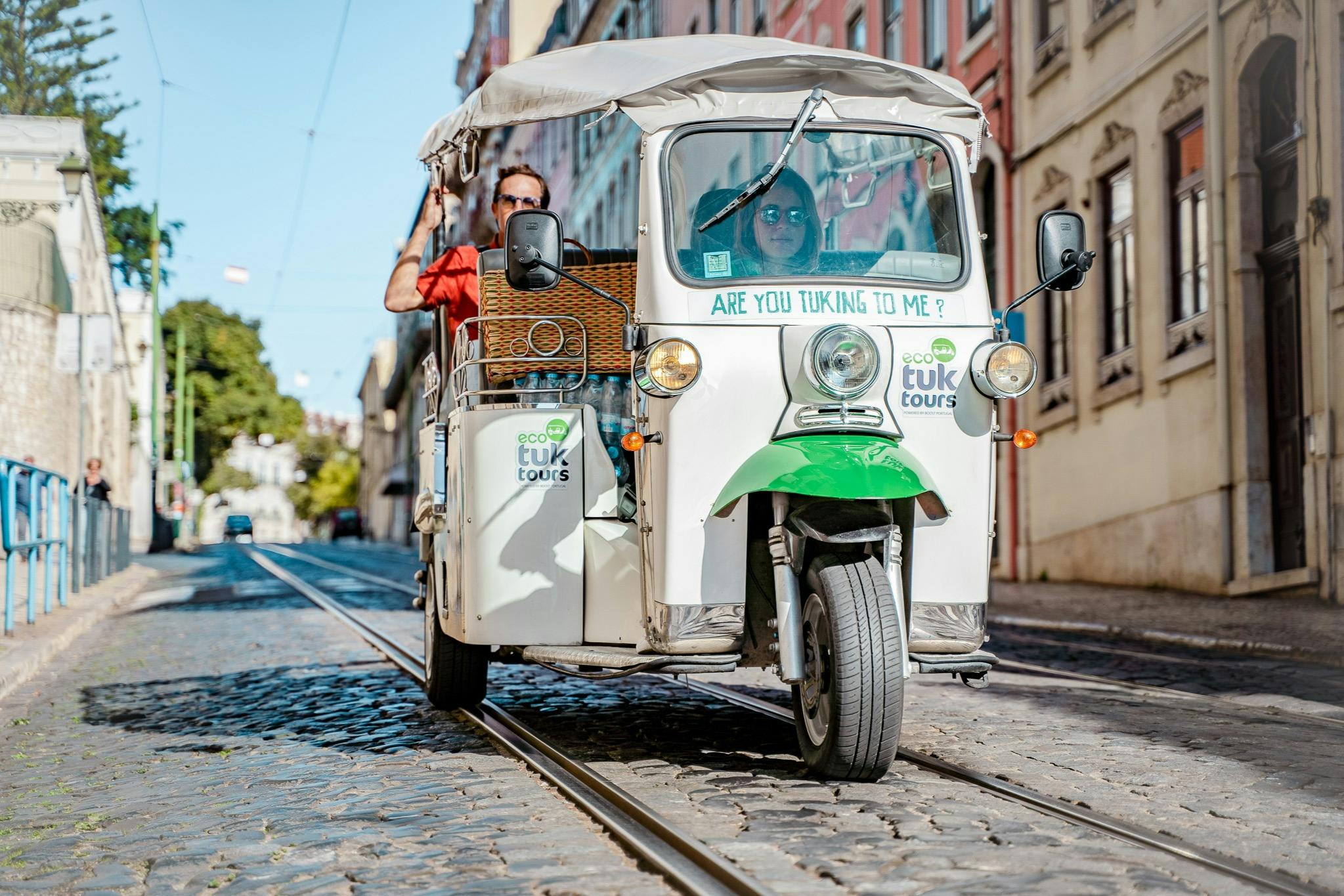Tourists on a tuk tuk guided tour in Lisbon